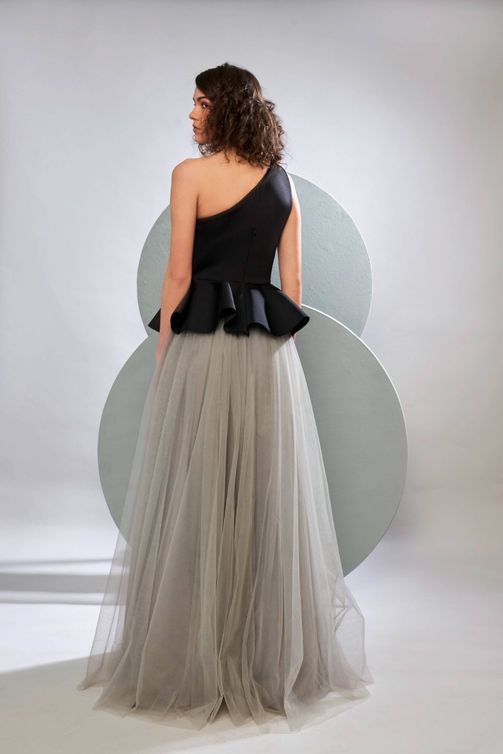One Shoulder Peplum Gown With Tulle Skirt